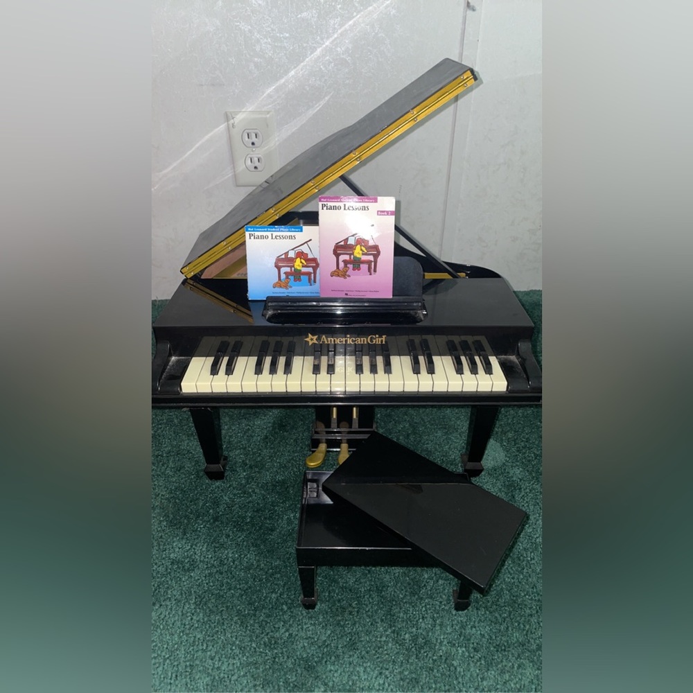 American girl doll piano in great condition and still plays music.